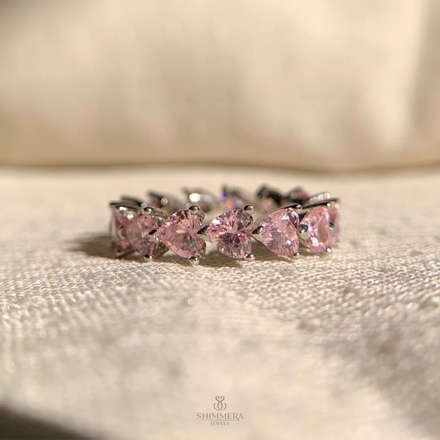 Women’s eternity wedding ring with heart cut diamonds all around