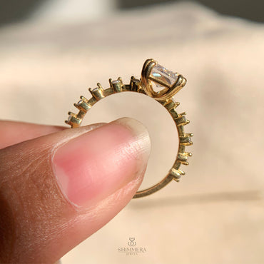 Elegant radiant cut diamond ring featuring side stone accents