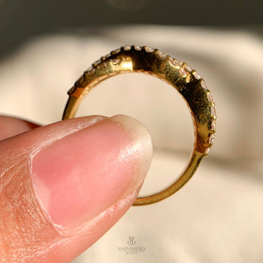 Elegant half infinity diamond engagement ring with pavé band