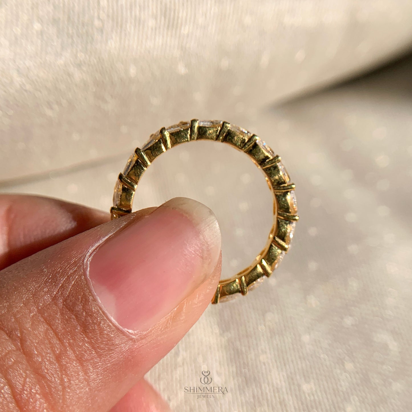 Modern full diamond eternity band with pear cut stones