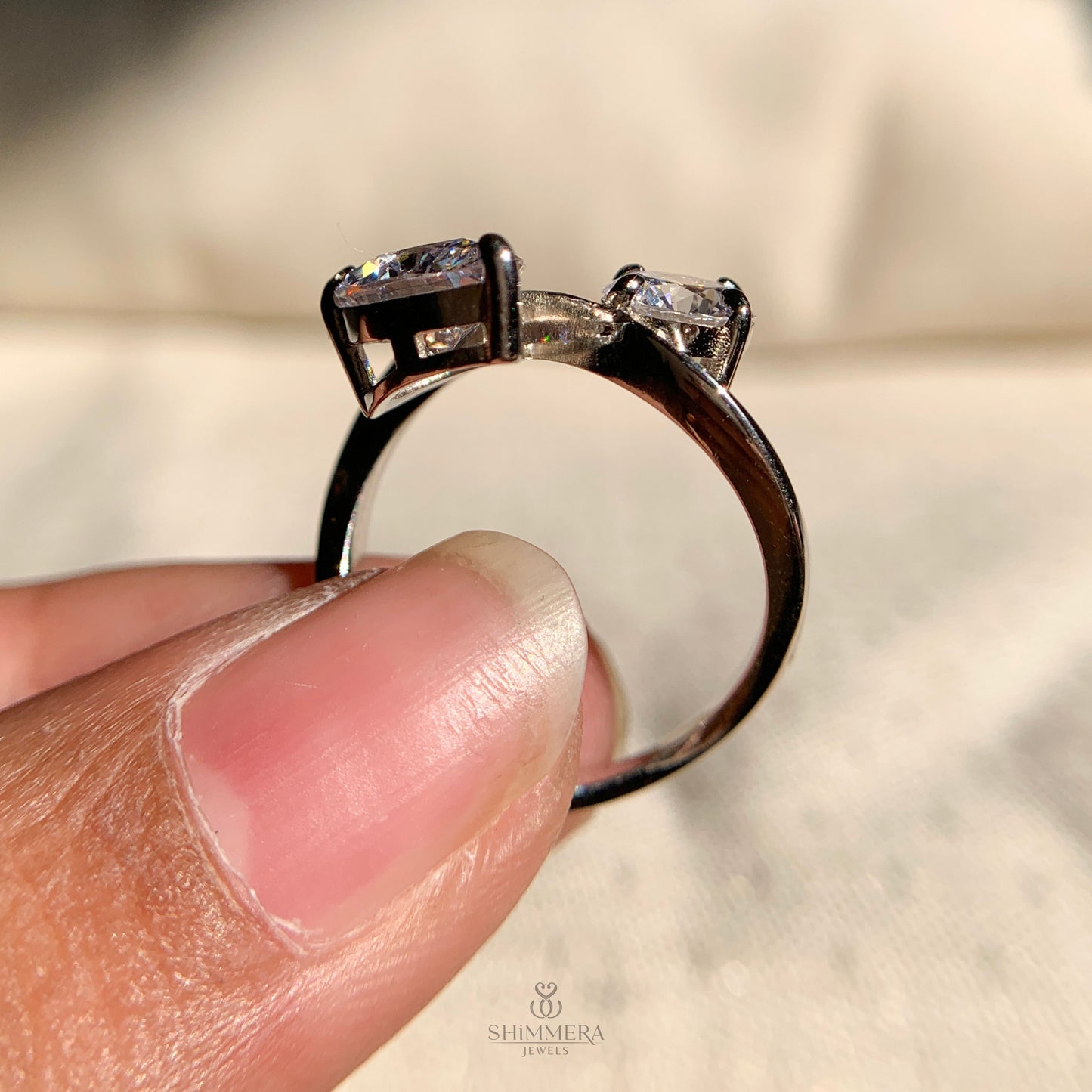 Designer Toi et Moi ring showcasing a round and pear diamond combination