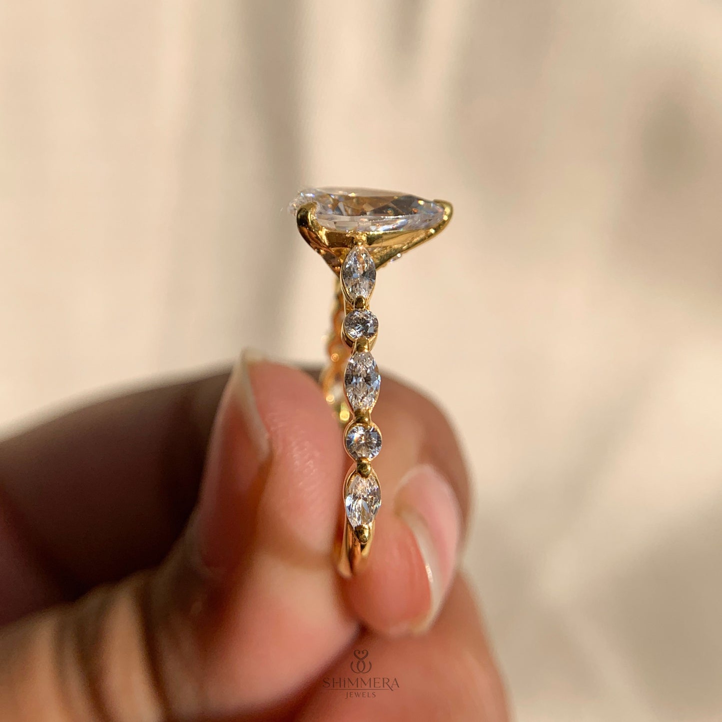 Pear Shaped Diamond Engagement Ring With Marquise Side Accents