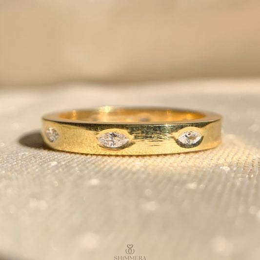 Moissanite marquise flush set diamond wedding band in 14k gold