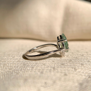 Elegant moss agate engagement ring with accent diamonds in sterling silver setting
