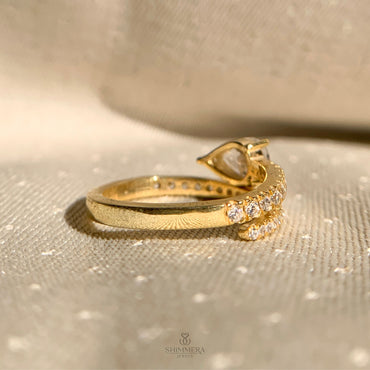 Elegant spiral diamond ring with east west set pear cut center stone for women