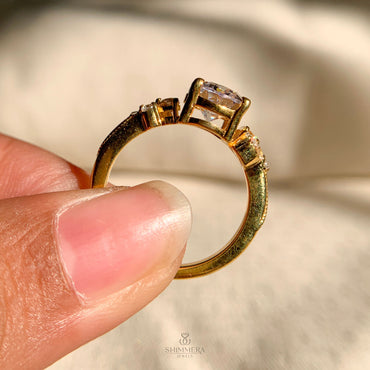 Gold oval cut diamond engagement ring with side stones