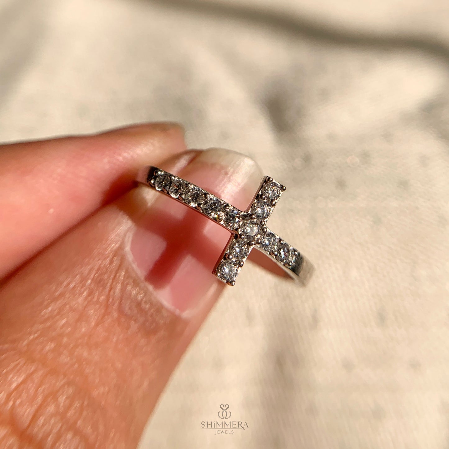 Stylish sterling silver diamond ring with cross accent