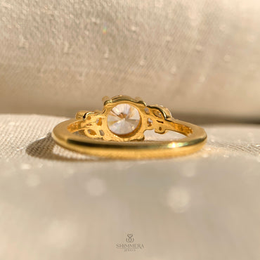 Classic round brilliant cut diamond ring featuring pave side stones for extra brilliance