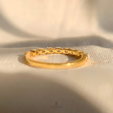 Elegant pear cut lab grown diamond band in polished yellow gold