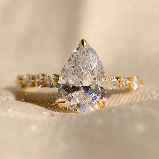 Pear Shaped Diamond Engagement Ring With Marquise Side Accents