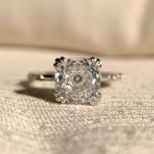 “Cushion cut double claw prong engagement ring in 14k white gold”