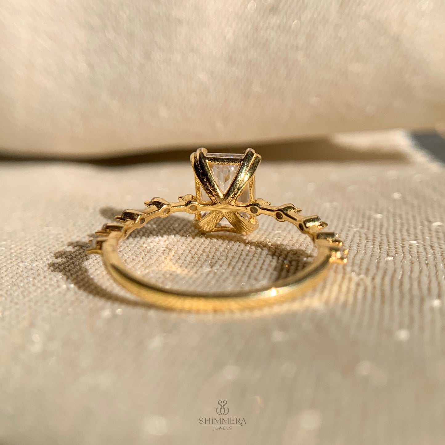 Luxury engagement ring with radiant cut center and shimmering side diamonds