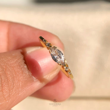 Elegant marquise cut diamond set horizontally in solid gold ring