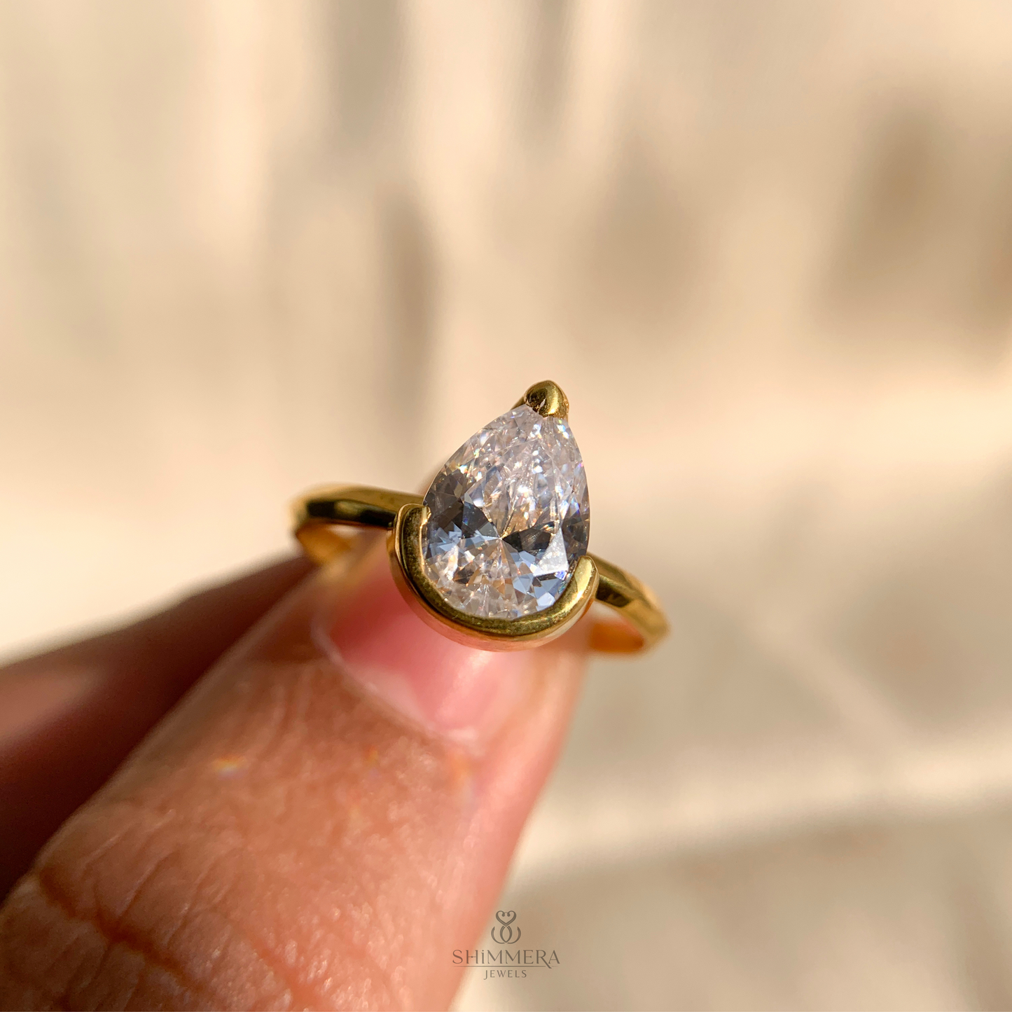 Half Bezel Pear Diamond Ring