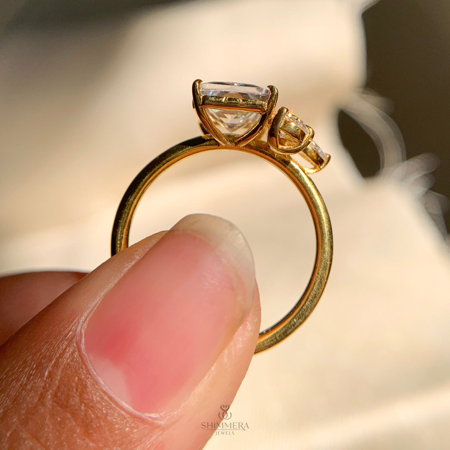 Dainty emerald cut moissanite ring with slim band for everyday elegance