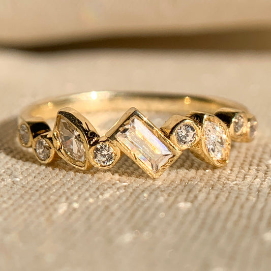 Elegant multi-shape bezel set diamond band in yellow gold