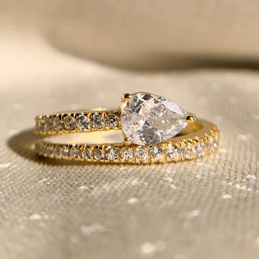 East West pear shape spiral diamond ring in 14k white gold, modern bypass design