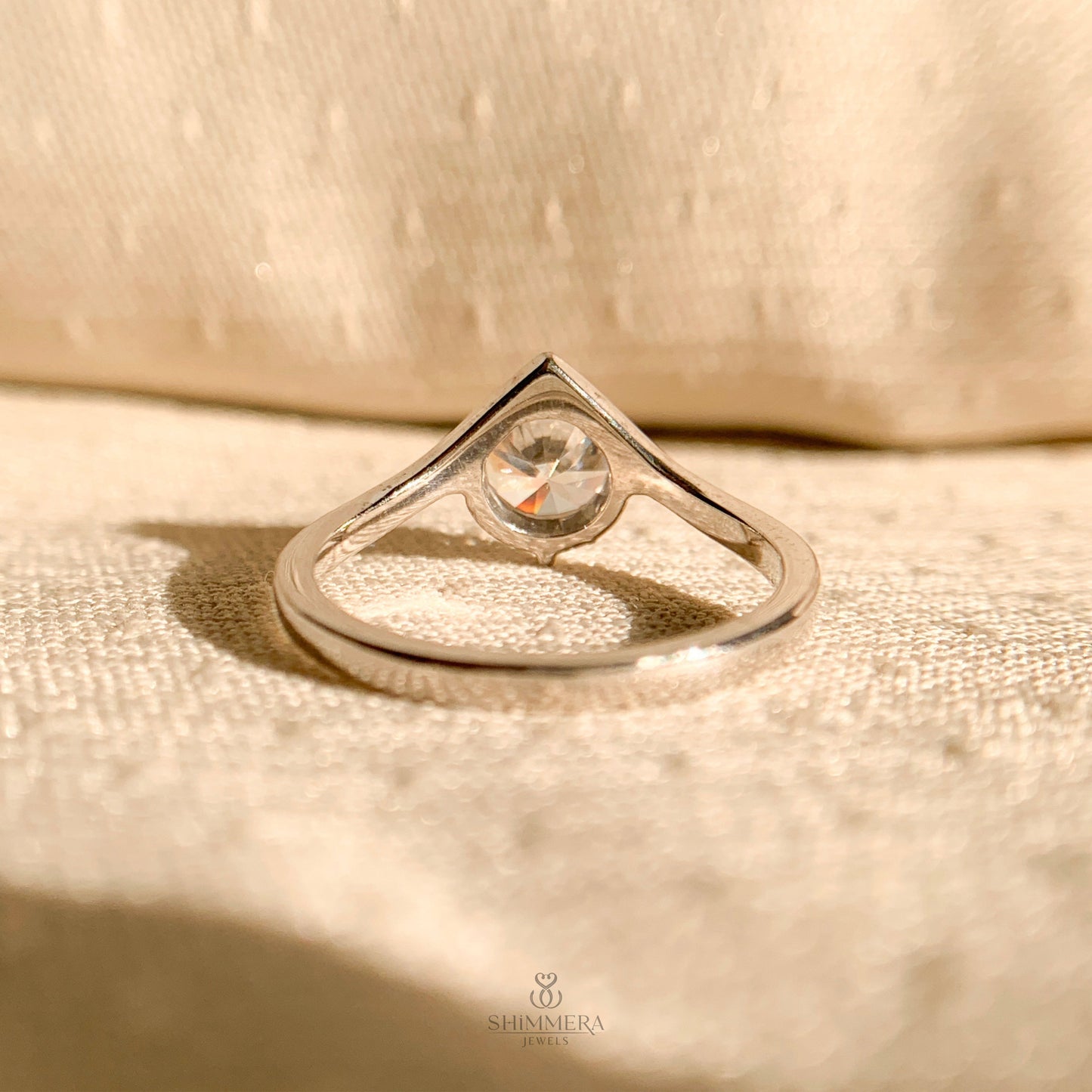 Timeless white gold solitaire engagement ring featuring 1 carat round diamond