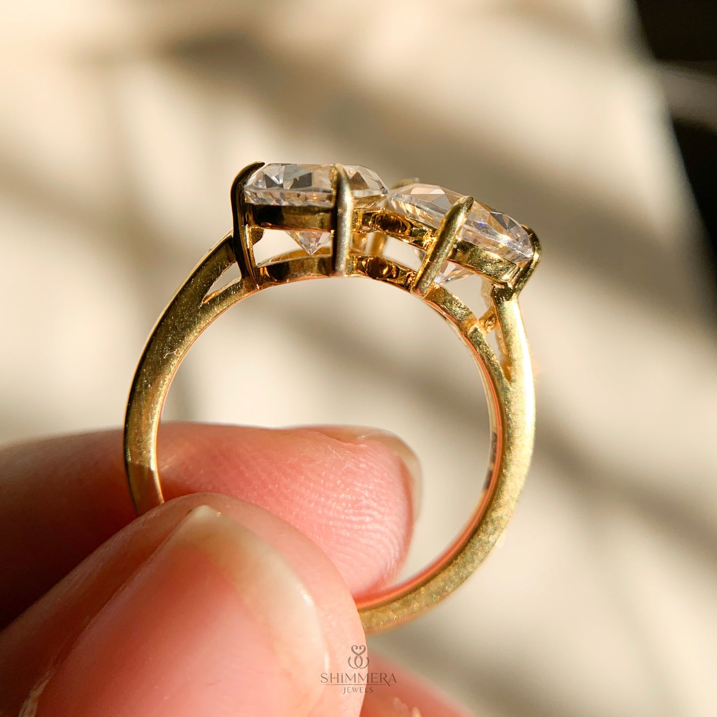 Moissanite pear cut and round cut double stone engagement ring design