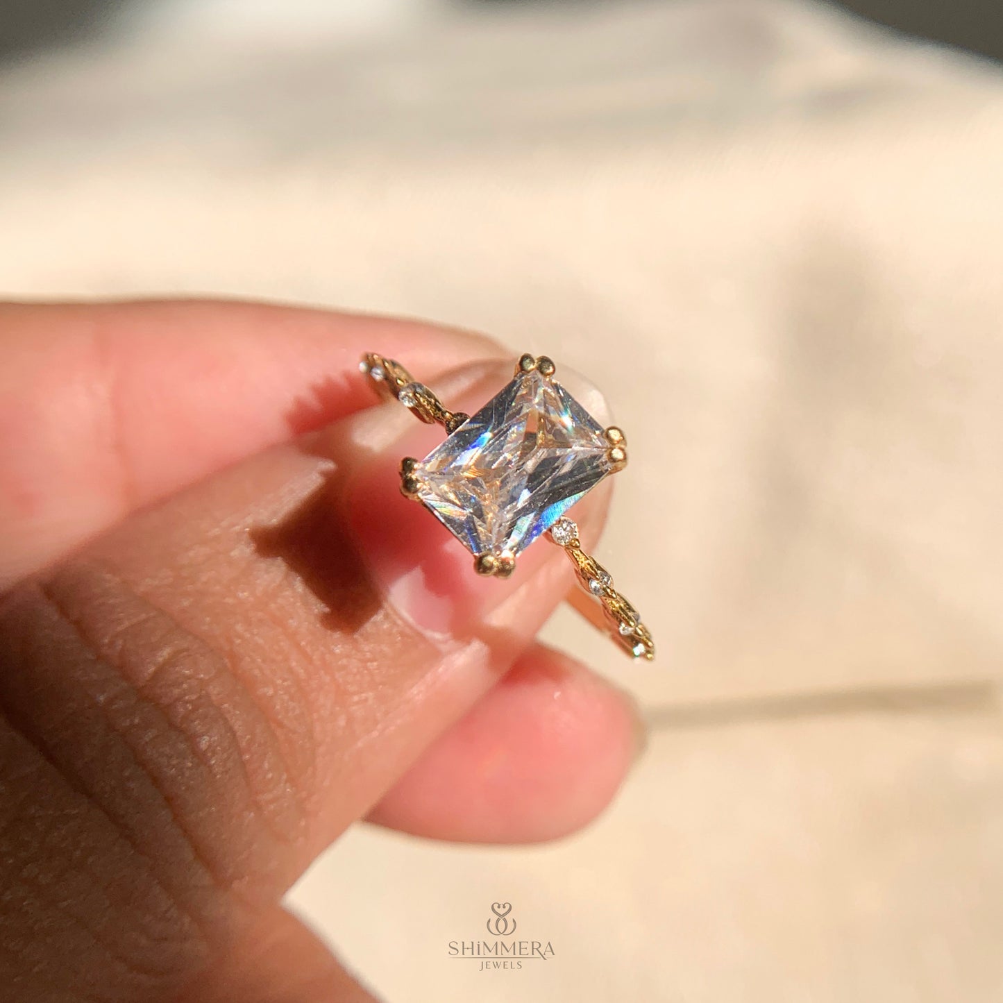 Modern radiant cut engagement ring with classic side stone setting