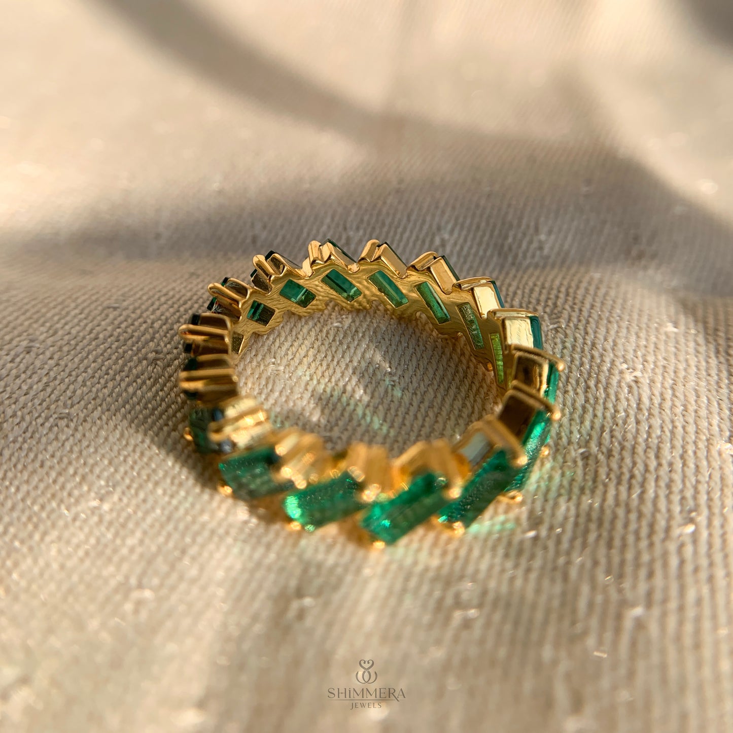 Dainty baguette emerald infinity ring perfect for stacking or bridal sets