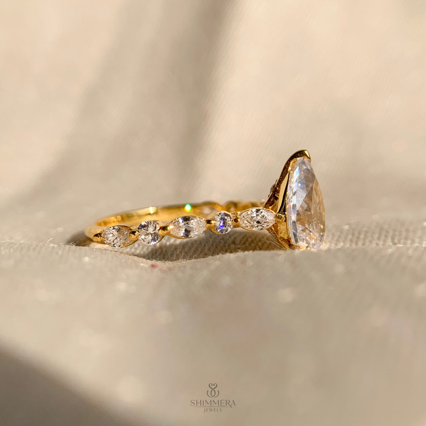 Pear Shaped Diamond Engagement Ring With Marquise Side Accents