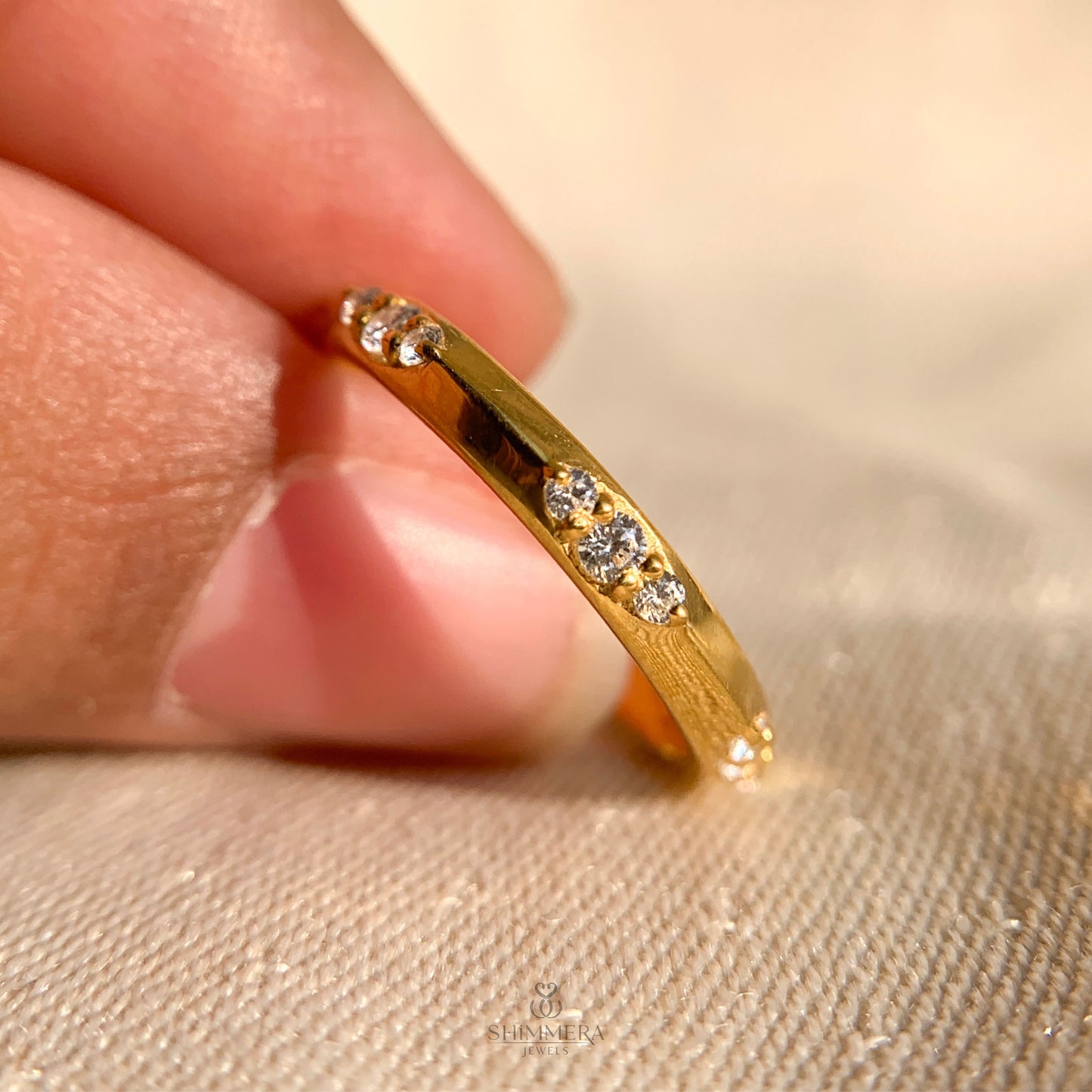 Modern round diamond flush set eternity wedding band