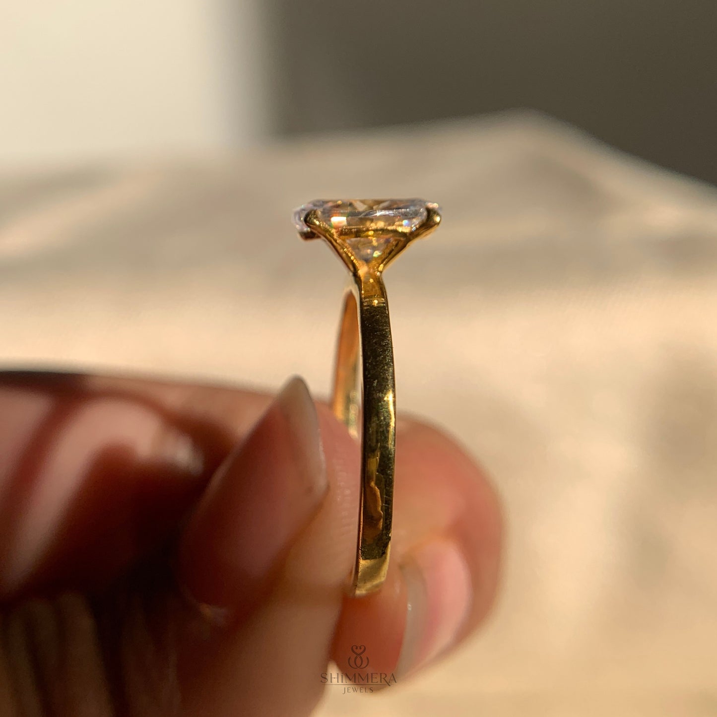 Timeless solitaire engagement ring featuring oval cut diamond
