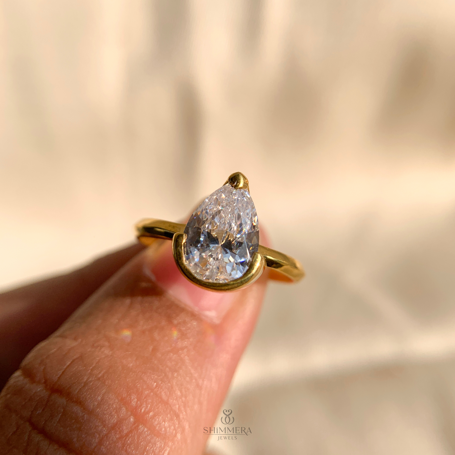 Half Bezel Pear Diamond Ring