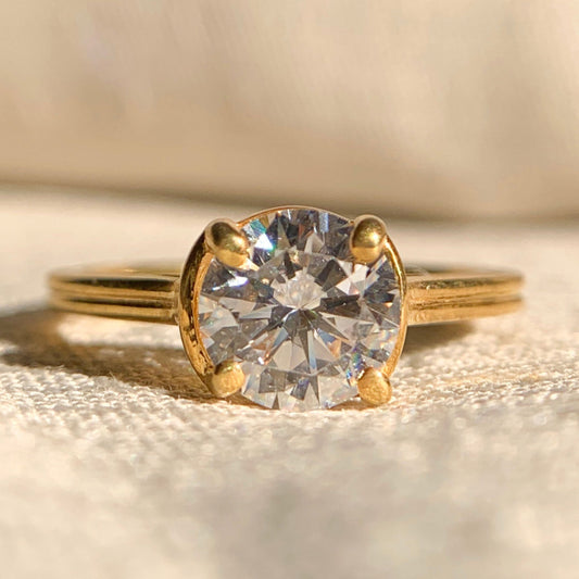 Classic round cut diamond solitaire engagement ring in white gold