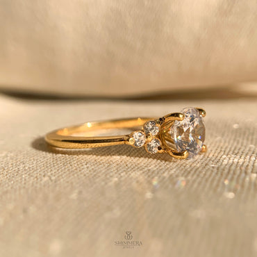 Elegant round cut engagement ring with diamond side accents