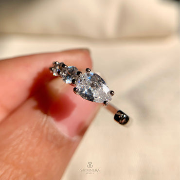 Elegant pear-shaped lab grown diamond cuff ring with graduated round diamonds