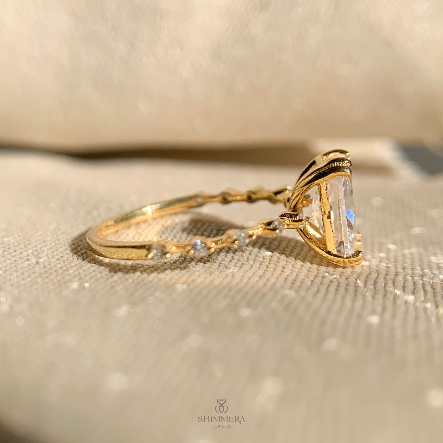 Timeless radiant cut diamond engagement ring flanked by side stones
