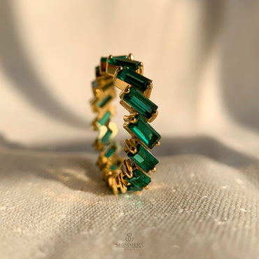 Elegant baguette emerald eternity ring with infinity design for weddings