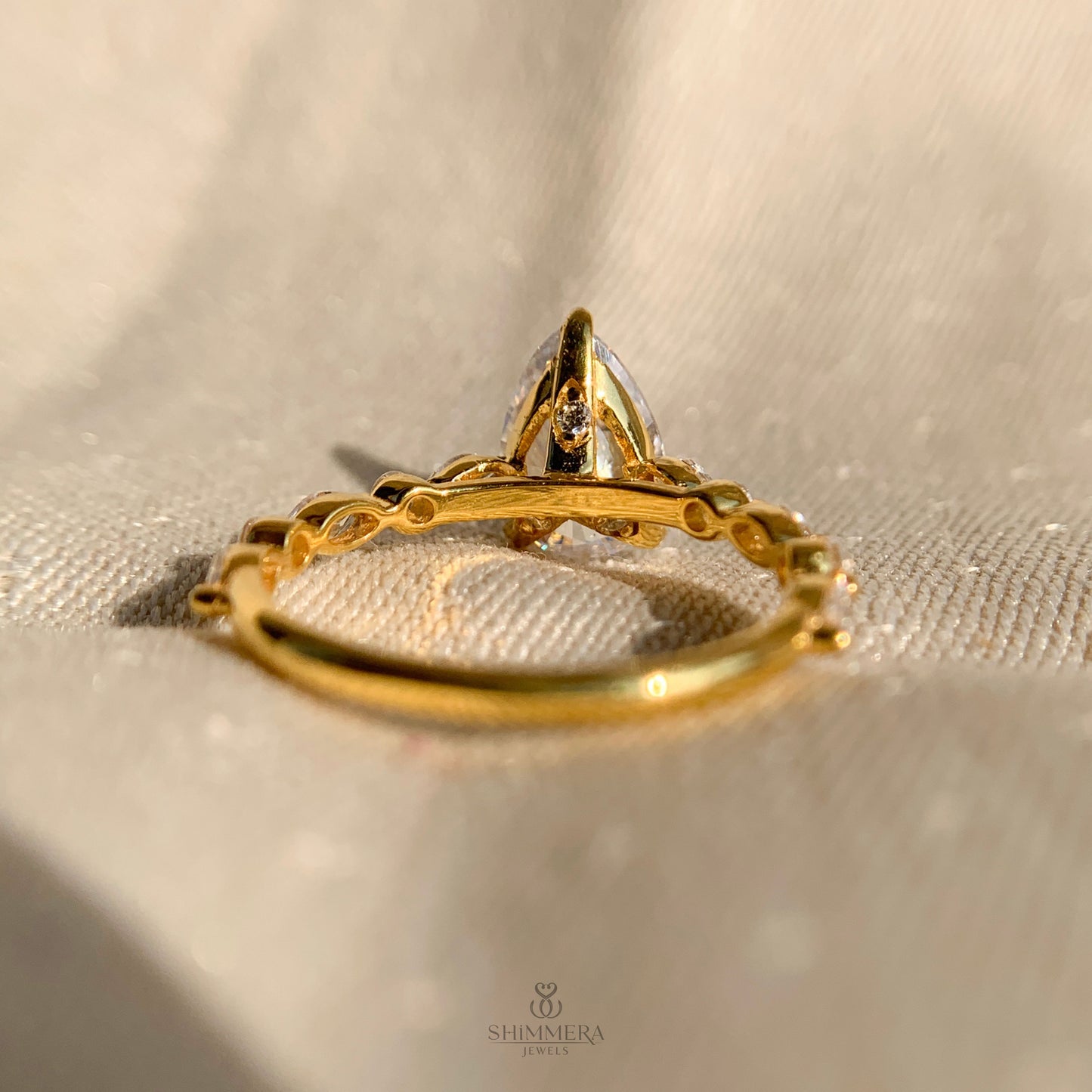 Pear Shaped Diamond Engagement Ring With Marquise Side Accents