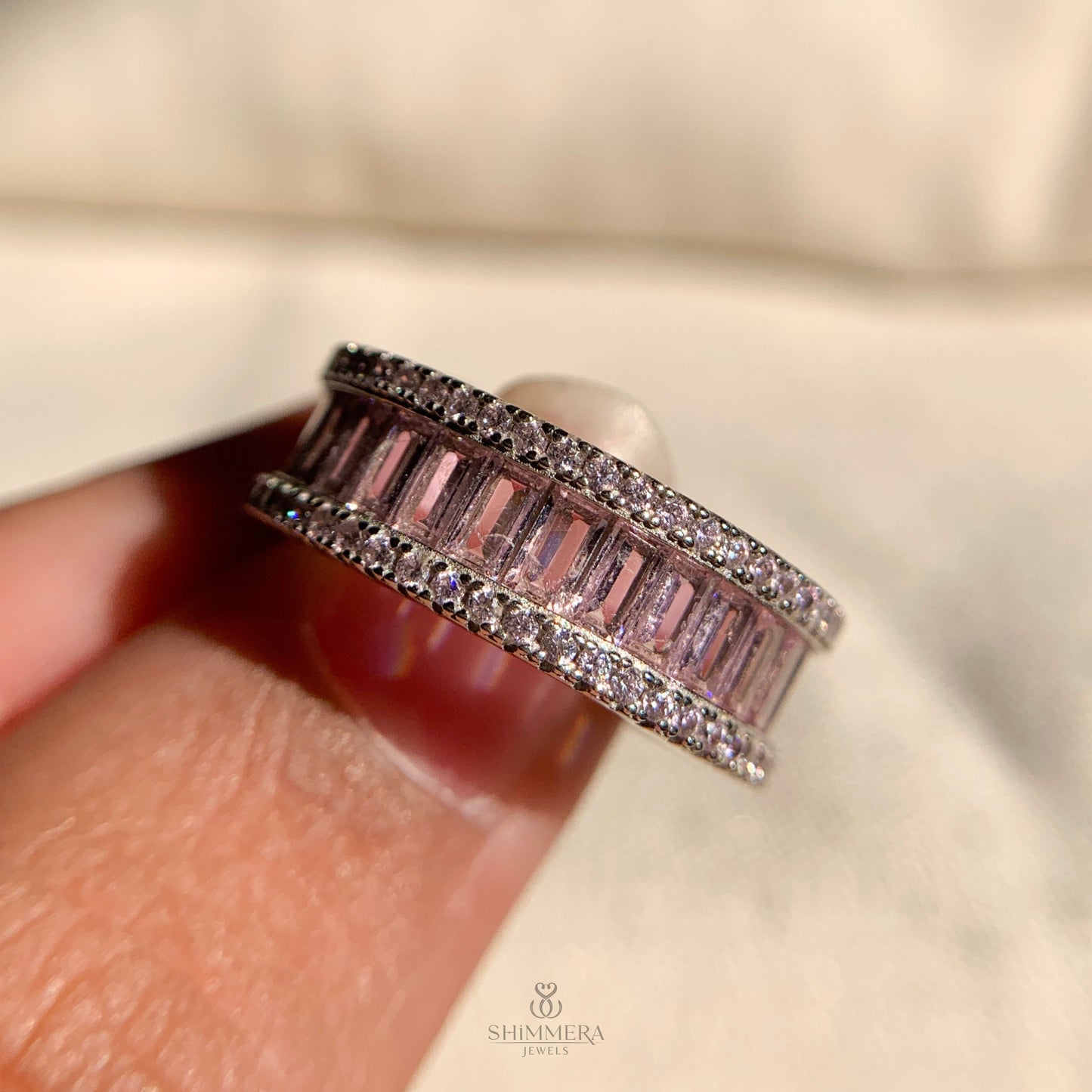 Timeless pink baguette anniversary ring in classic white gold design