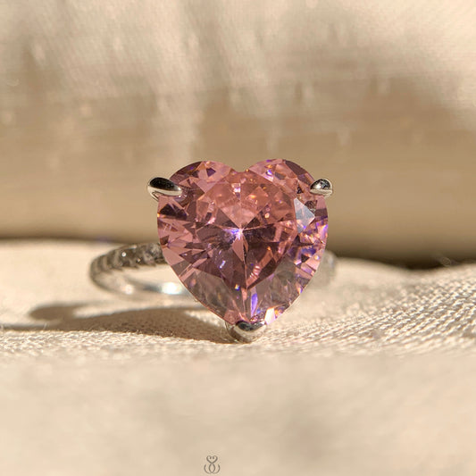 Pink diamond pave band with heart cut solitaire engagement ring in white gold