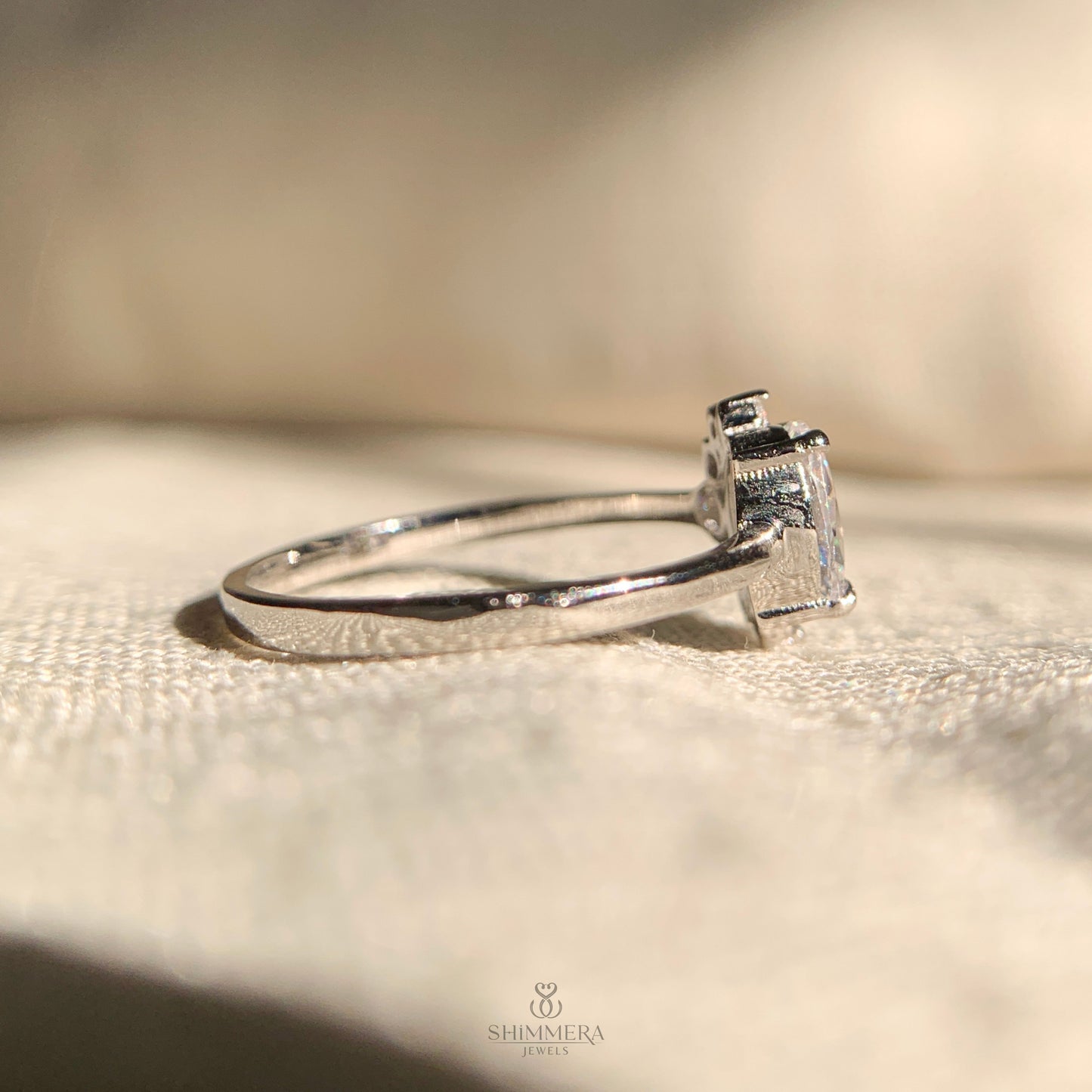 "White gold engagement ring with 1 carat oval lab grown diamond cluster"