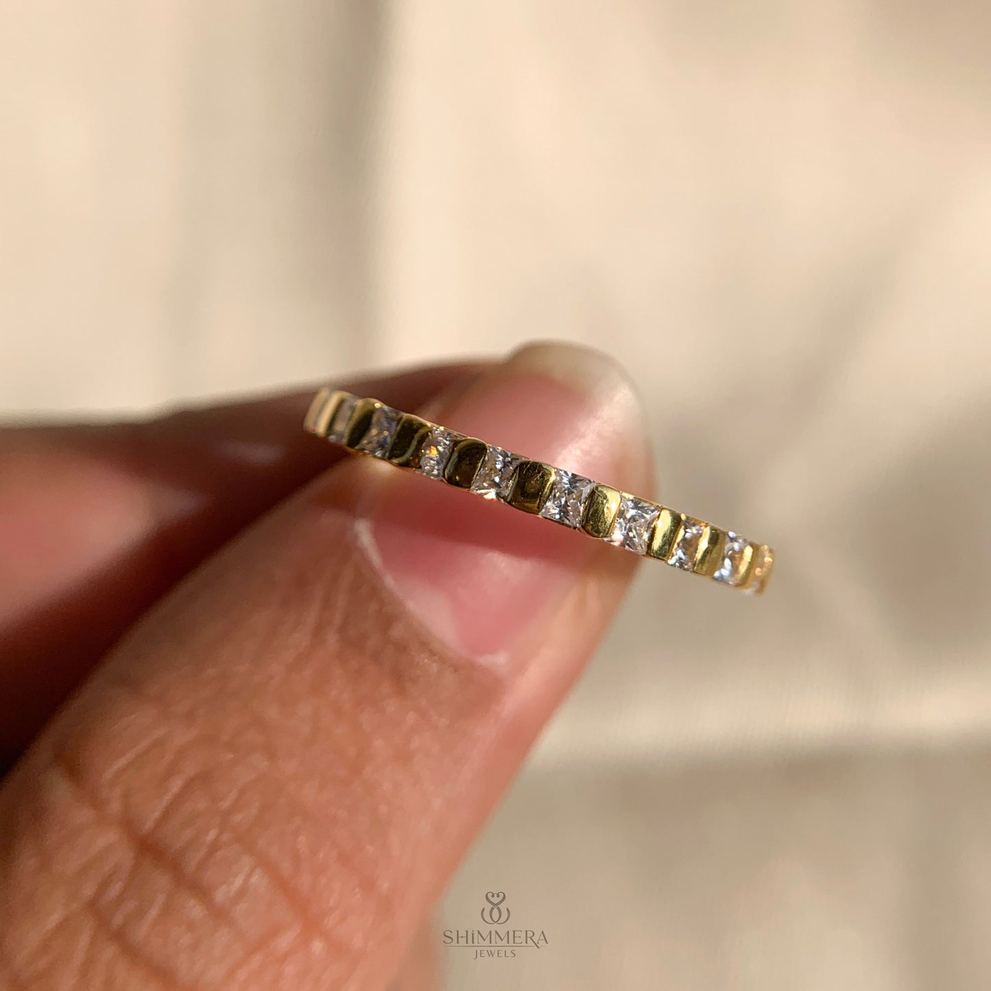 Timeless engagement ring featuring princess cut diamond in bar setting