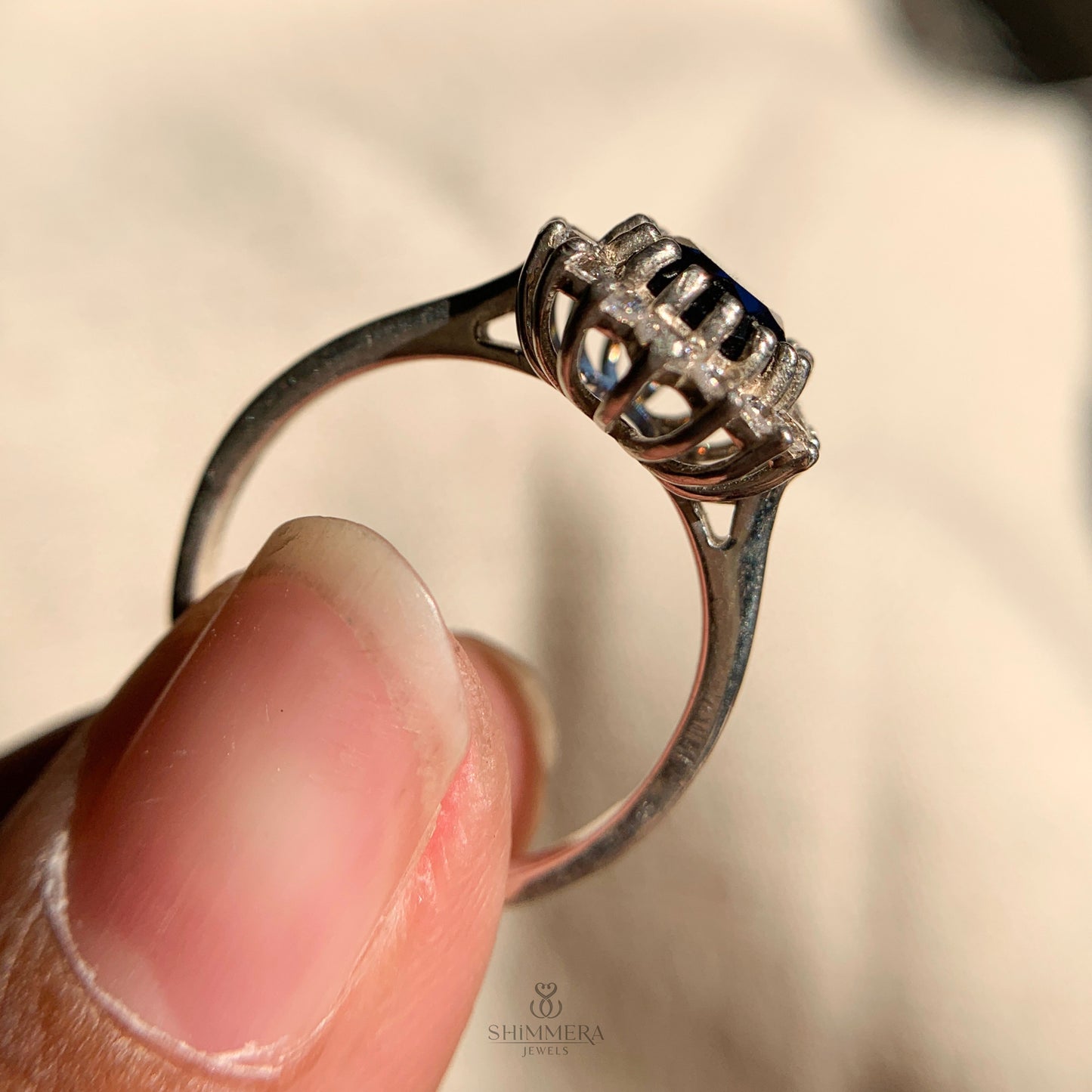 Oval cut sapphire engagement ring with delicate diamond band