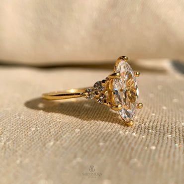 Elegant pear shaped diamond engagement ring with side stones in white gold