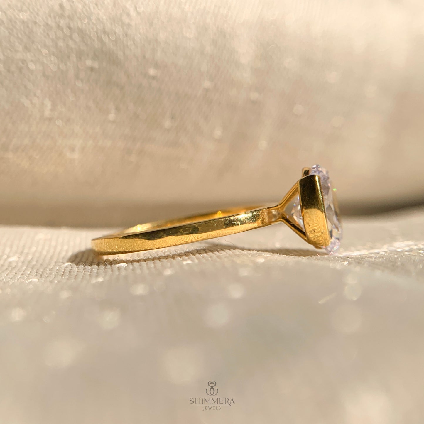 Half Bezel Set Oval Diamond Ring