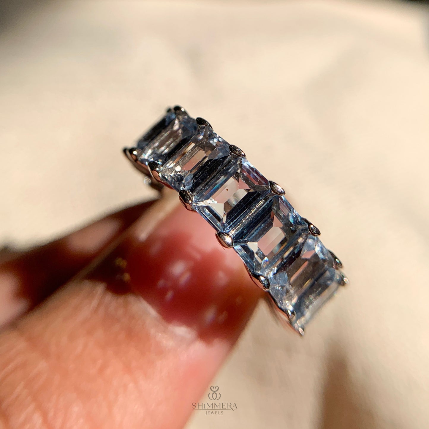 Timeless aquamarine eternity wedding band with sleek rose gold finish
