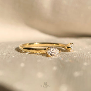 Minimalist open wedding band with pear-shaped diamond accents