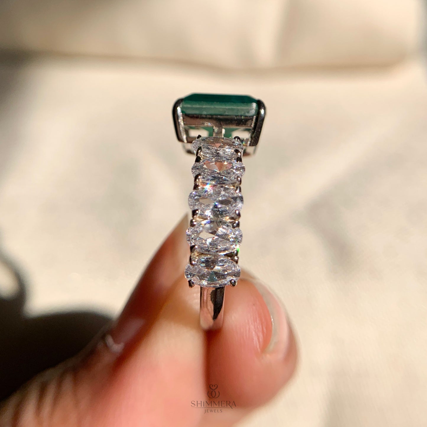 Contemporary wedding band featuring open design and mixed diamonds