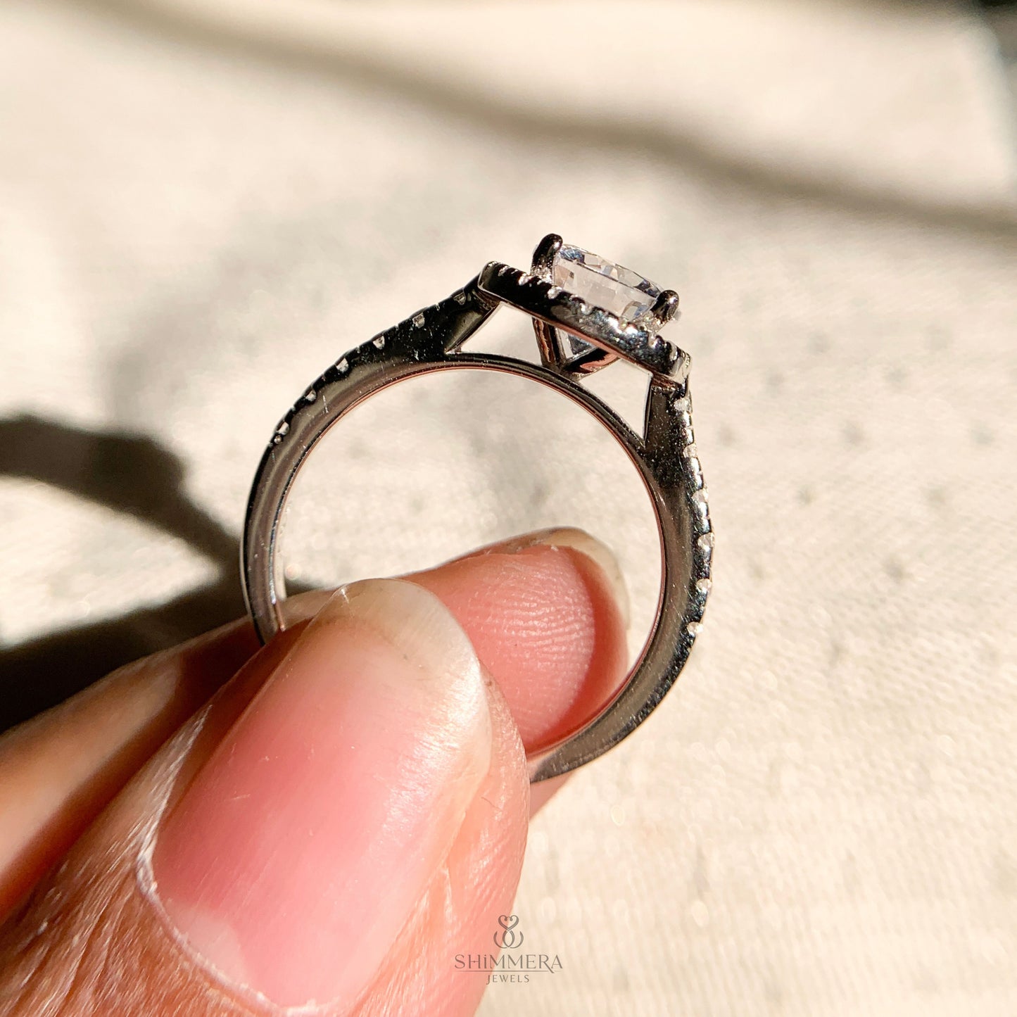 “White gold halo setting with 1.0 carat round diamond engagement ring design”