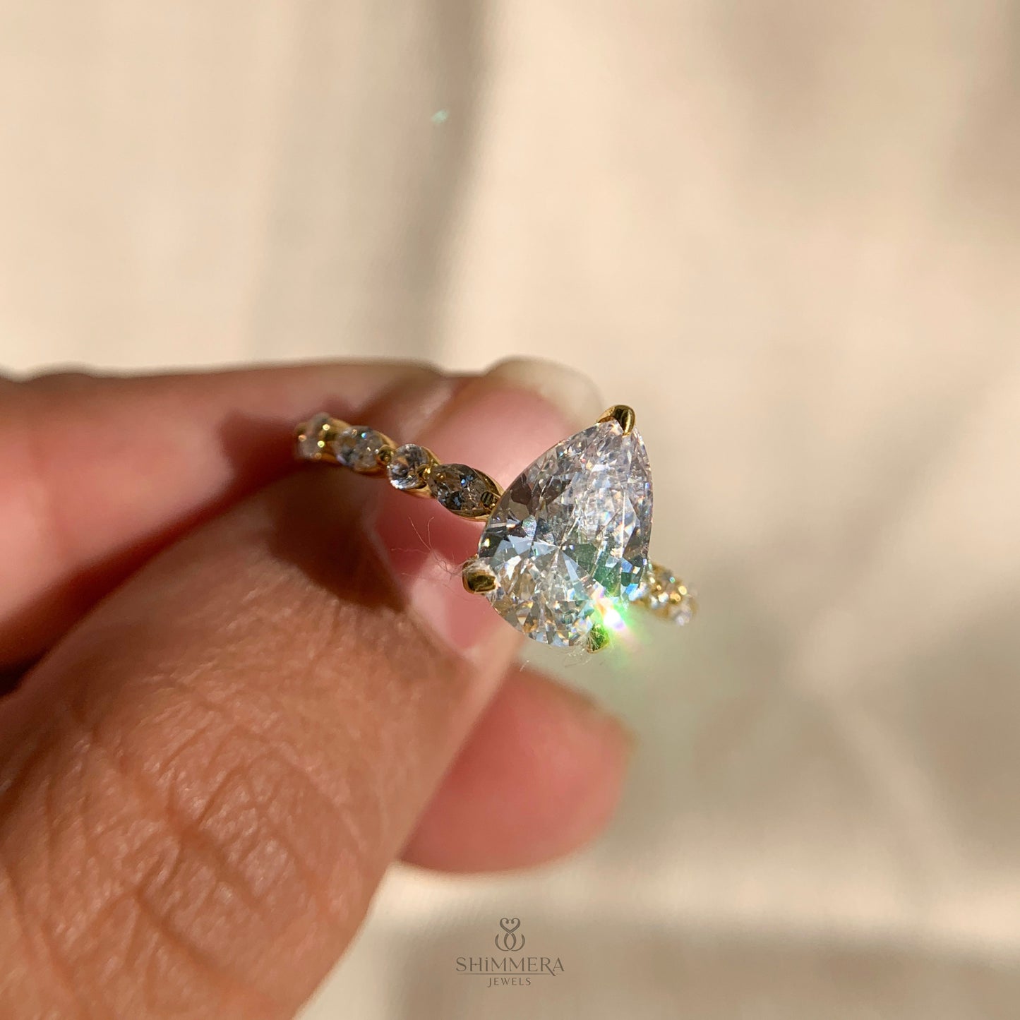 Pear Shaped Diamond Engagement Ring With Marquise Side Accents