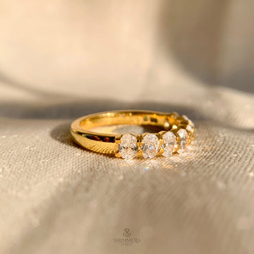 Elegant oval shaped diamond eternity ring in 14k yellow gold