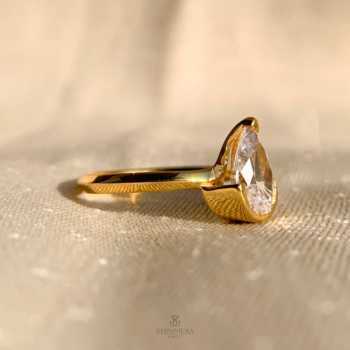 Half Bezel Pear Diamond Ring