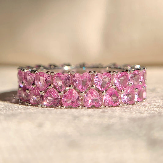 Elegant pink heart shaped diamond band in rose gold setting